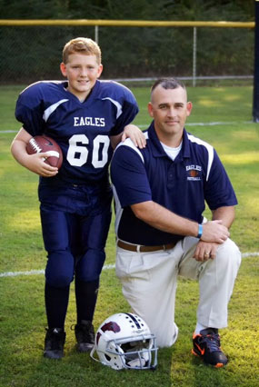 Greg coaches his son's football team